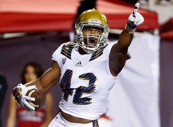 Kenny Young gestures during a UCLA football game.